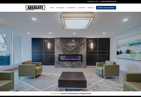 Modern office lobby with fireplace, green seating, and contemporary design featuring black wall panels and marble accent