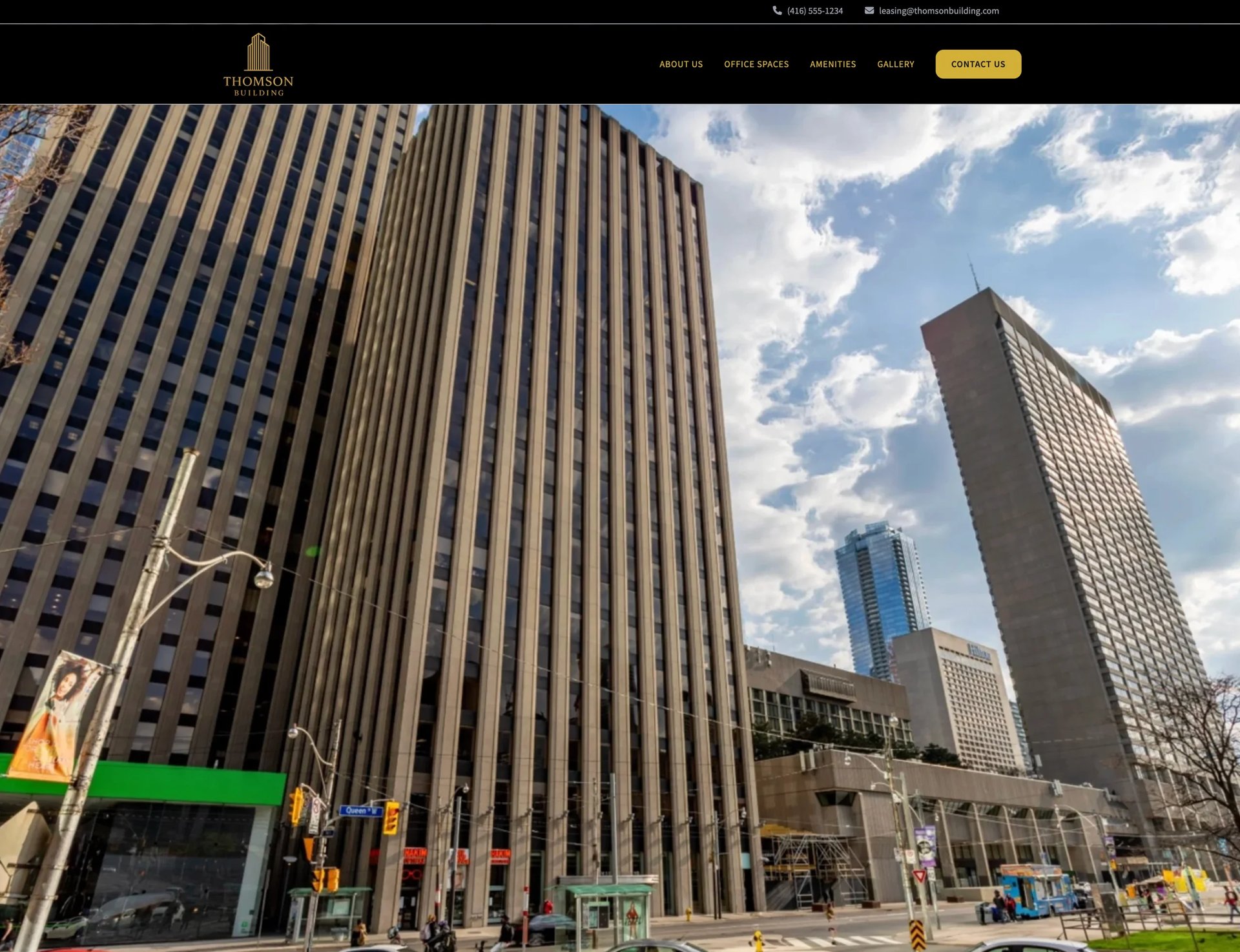 Street view of downtown skyscrapers and tall office buildings with blue sky and clouds