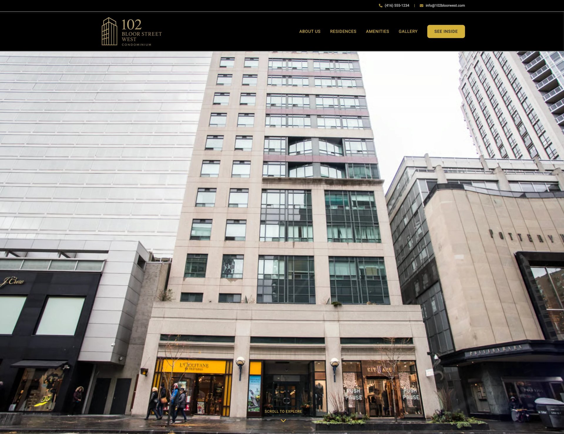 Tall modern mixed-use building with commercial storefronts on ground level and residential or office units above, located on an urban street